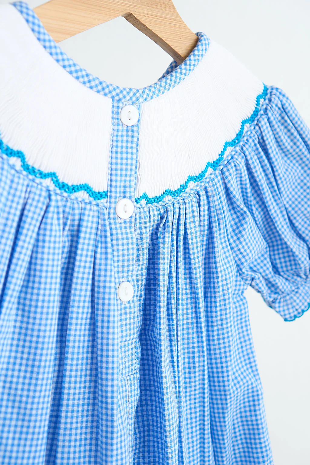 Blue snow princess hand smocked gingham girl romper - Image 5